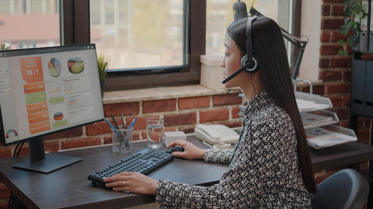 close-up-asian-woman-with-headphones-talking-phone-call-people-customer-service-consultant-using-headset-microphone-working-call-center-computer-support-chat.jpg