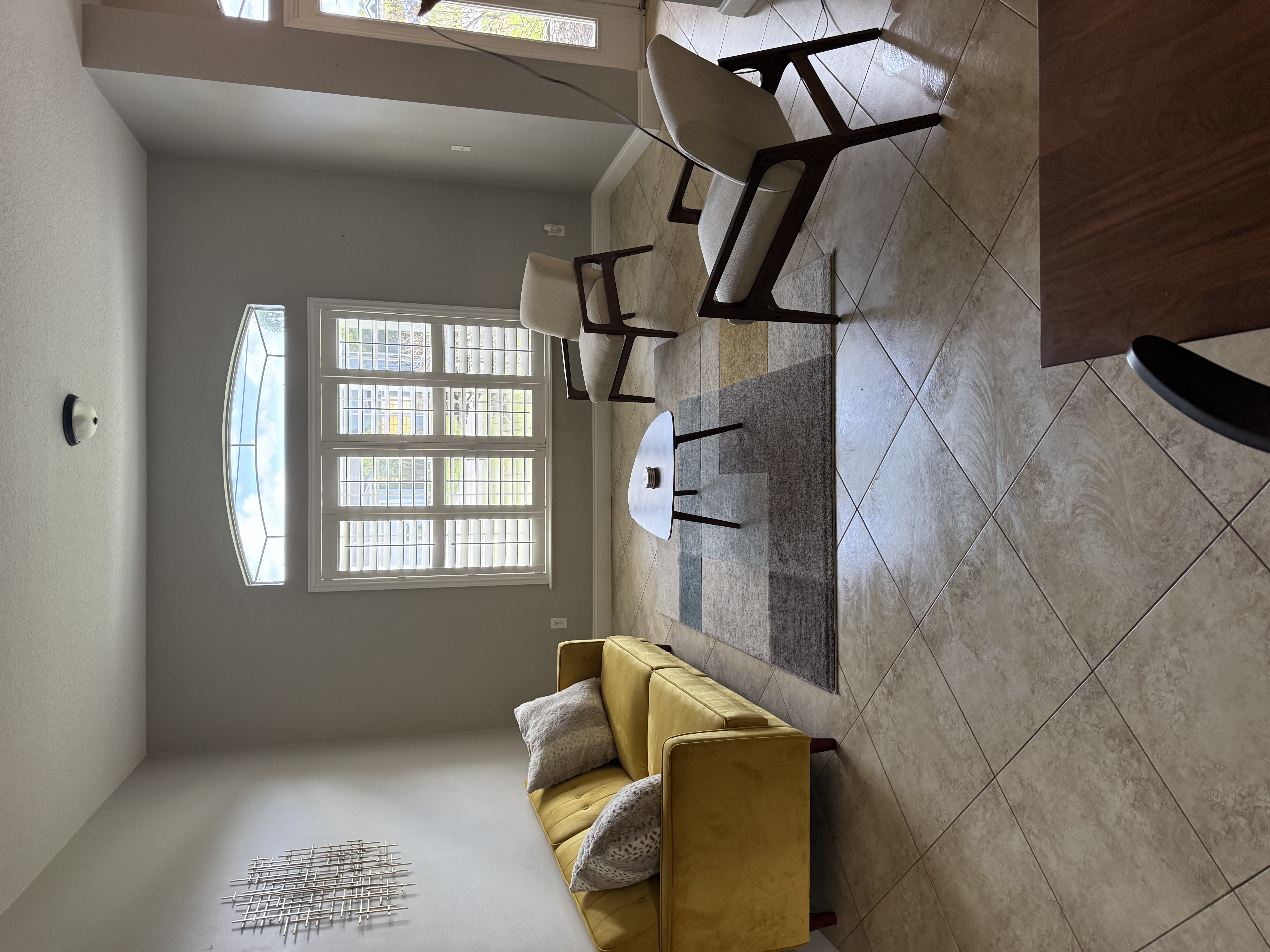 The Hero Kitchen Island - dark countertops, spotless breakfast bar, warm lighting