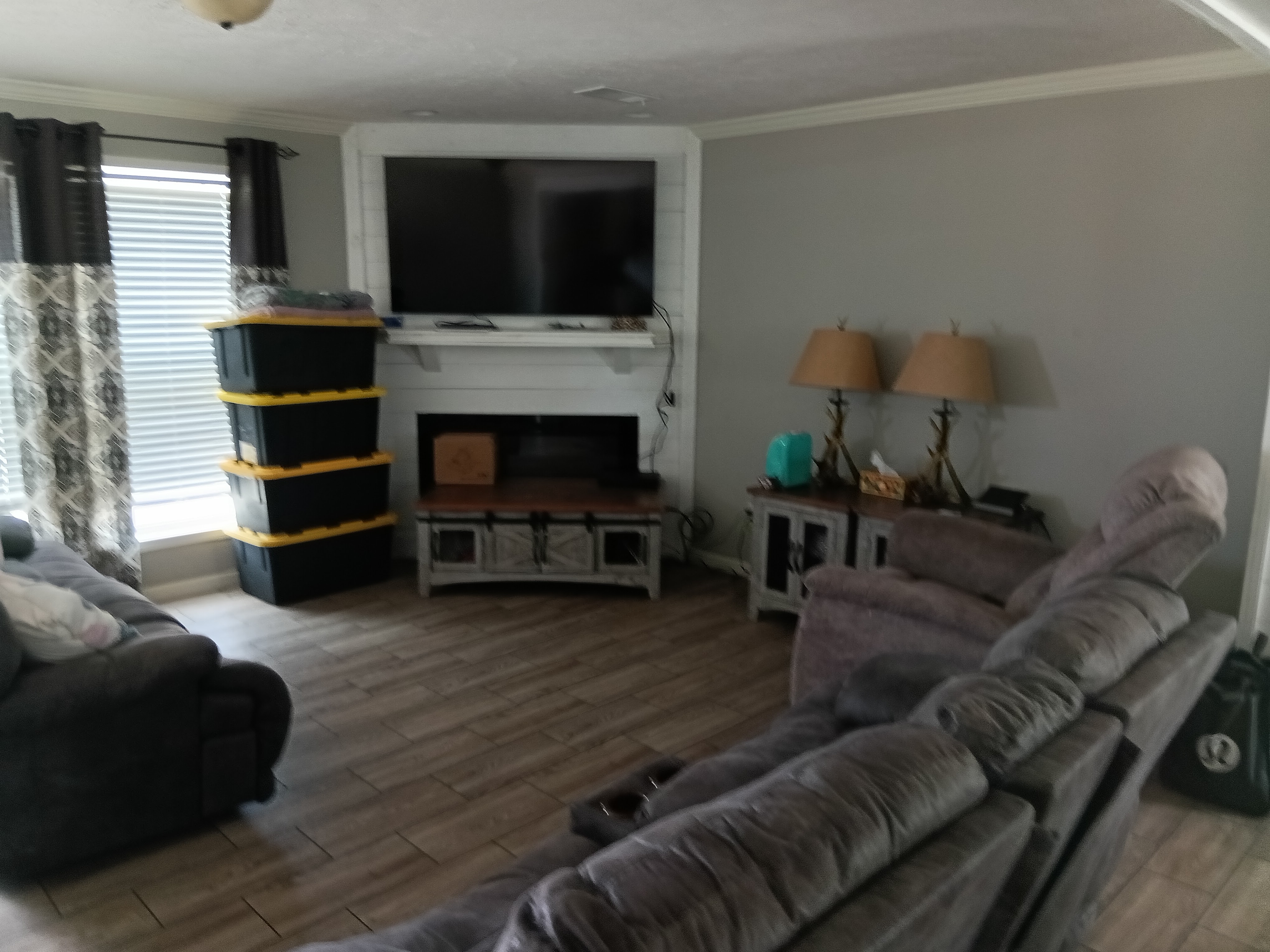 Staged Primary Bedroom - new bed dressing, clean wood-look flooring, perfect staging