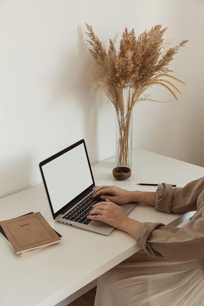 premium photo _ beautiful woman working, typing on laptop_ cozy comfortable home office workspace interior design.jpeg