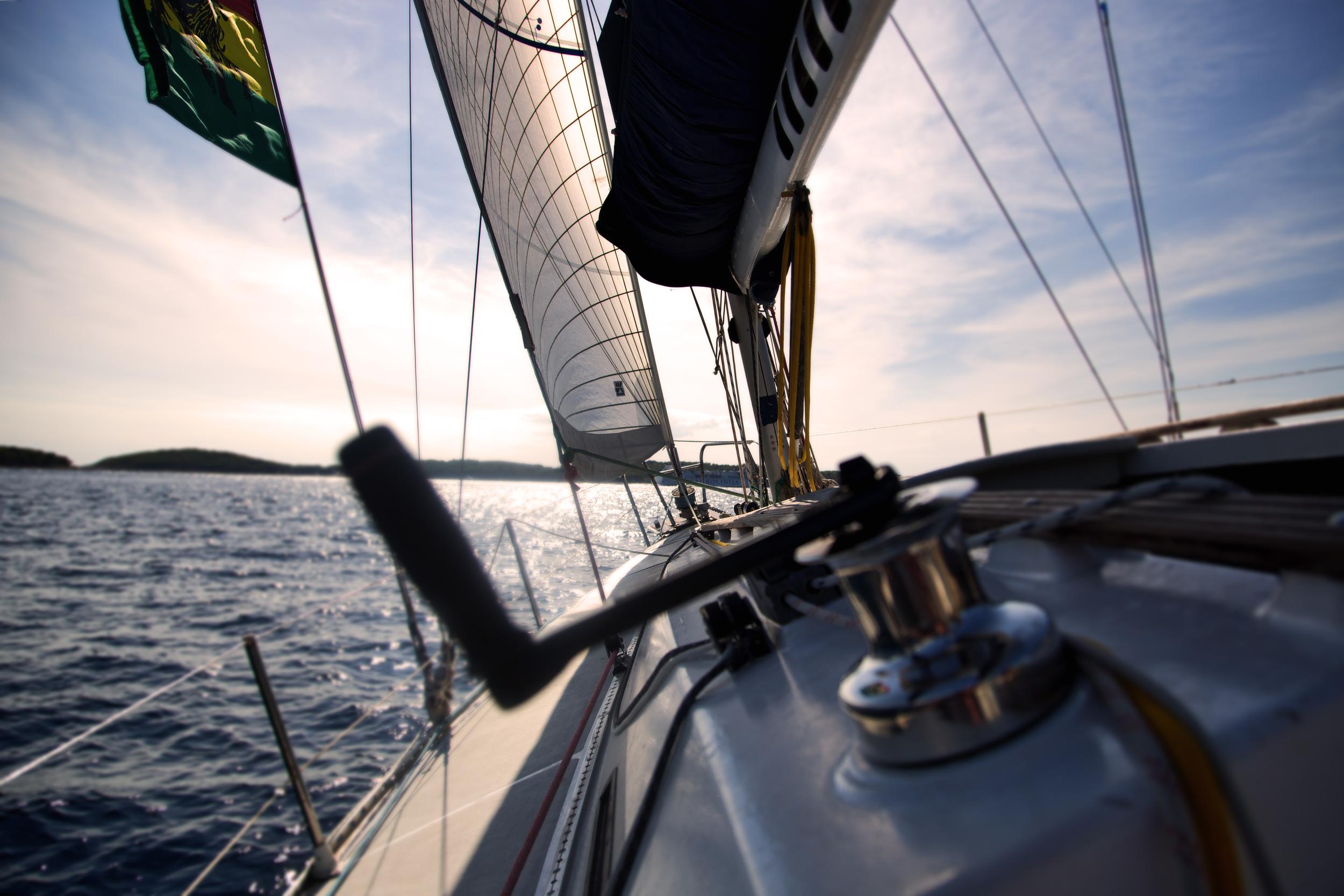 sailing boat surrounded by water during daytime