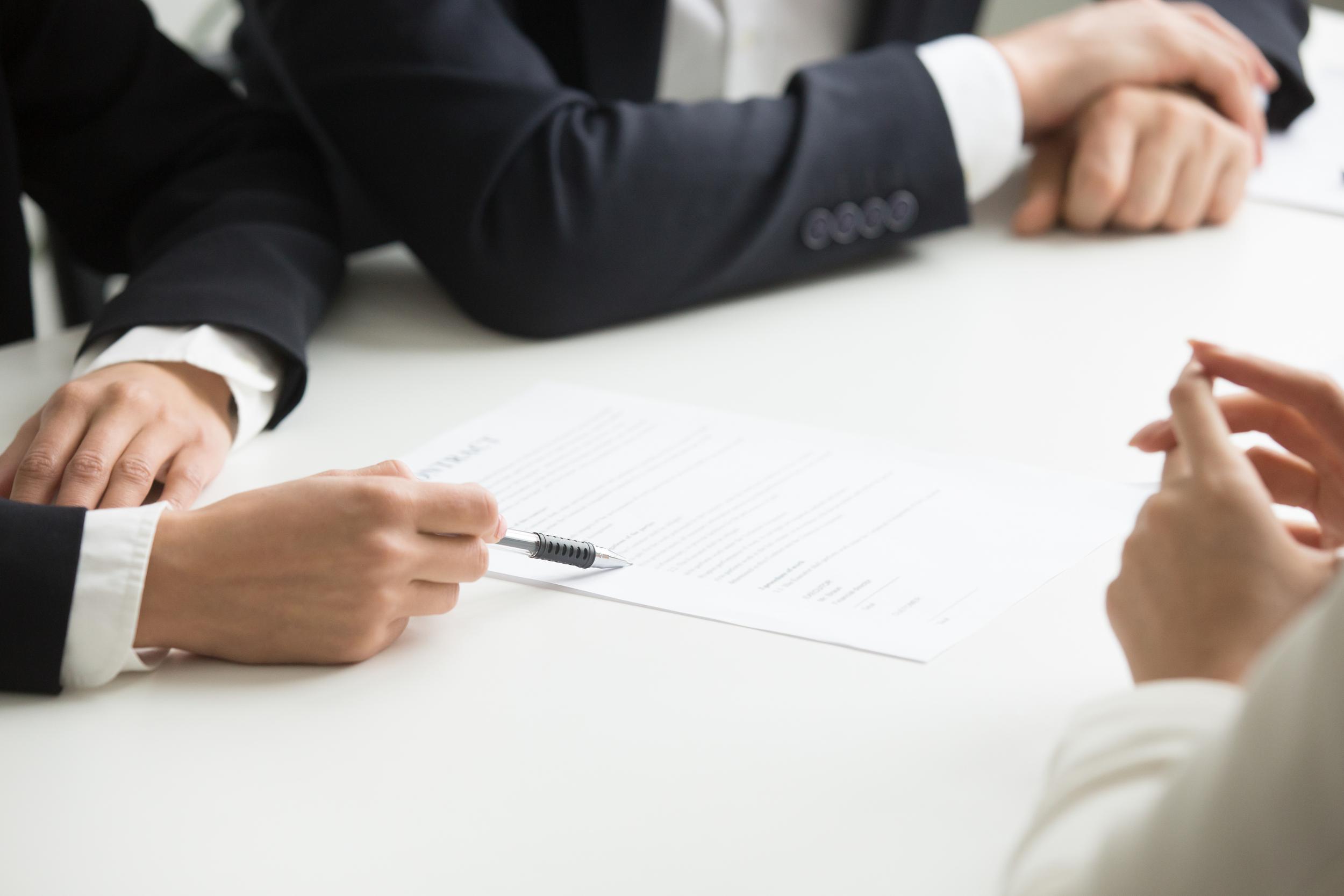 11eb 9e9f negotiations about contract terms concept hand pointing document